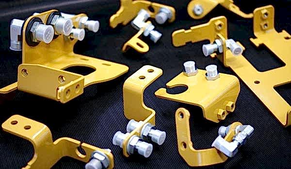 Assembled hydraulic hose brackets